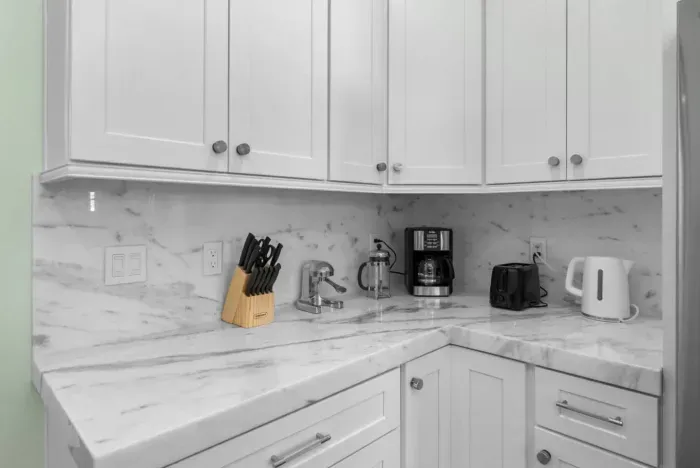 Countertop appliances include a drip coffee maker, kettle and toaster