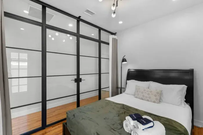 Sleek glass wall with curtains for privacy