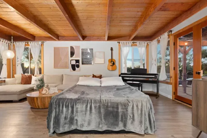 Another cozy angle of the main bedroom—soft light and relaxed comfort.
