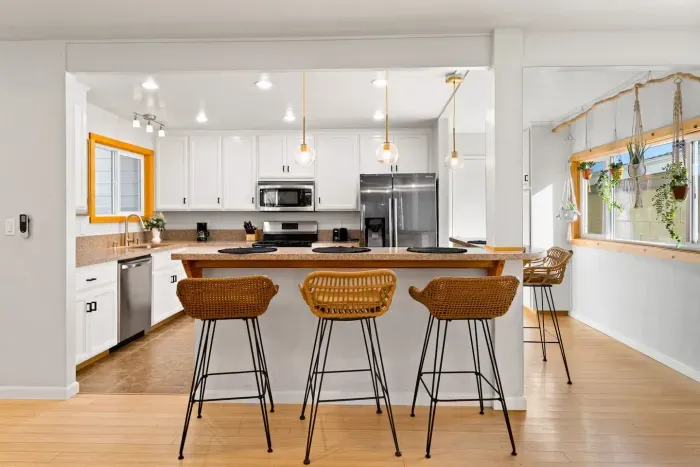 A bright, open kitchen with seating for everyone to gather and chat.