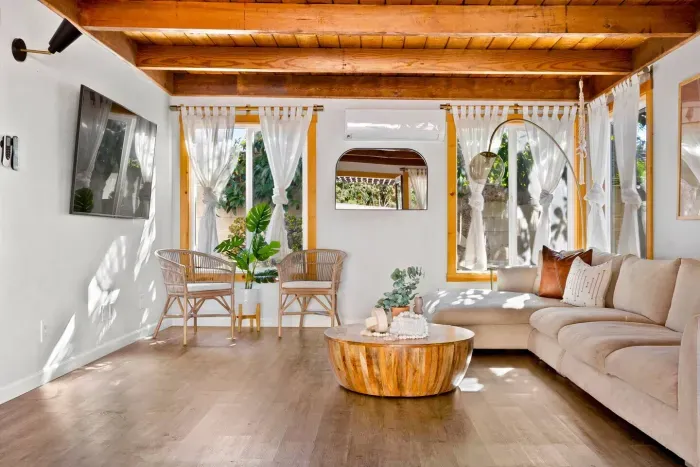 A warm, sunlit living space where you can settle in and relax fully.