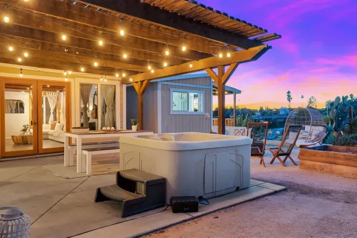 Your hot tub nook, perfect for unwinding beneath string lights.