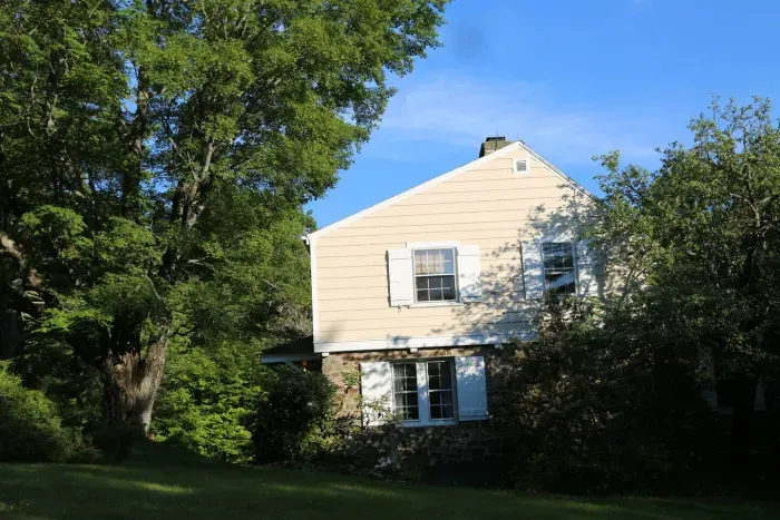Side of home from grassy lawn