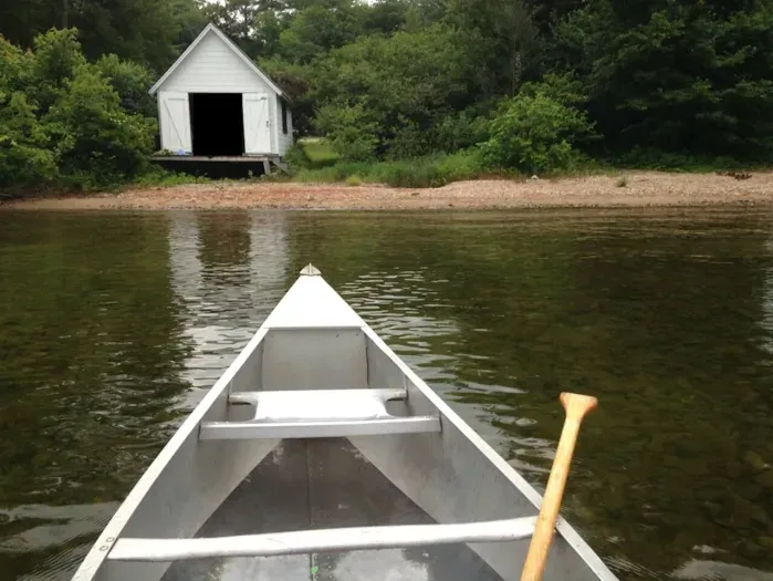 Canoeing on Newfound Lake toward Boat House