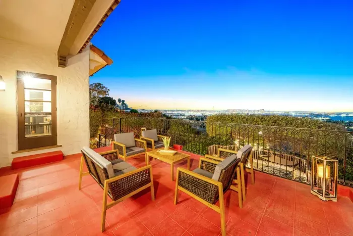 Morning coffee with sweeping views — serenity framed by terracotta charm.