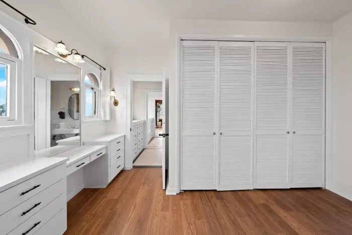 Elegant vanity and warm lighting make mornings effortless.