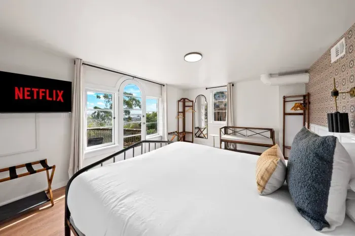 Morning sun spills into a room designed for deep rest.