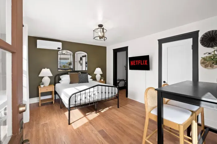 Modern comfort meets vintage flair in this cozy retreat with Netflix nights.