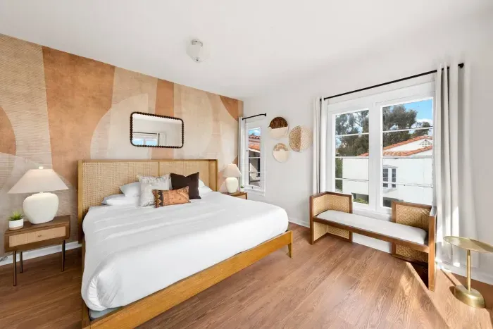 Modern textures create a peaceful master retreat.