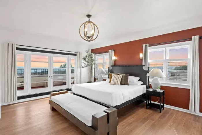 Earthy walls meet airy windows — a perfect coastal retreat.