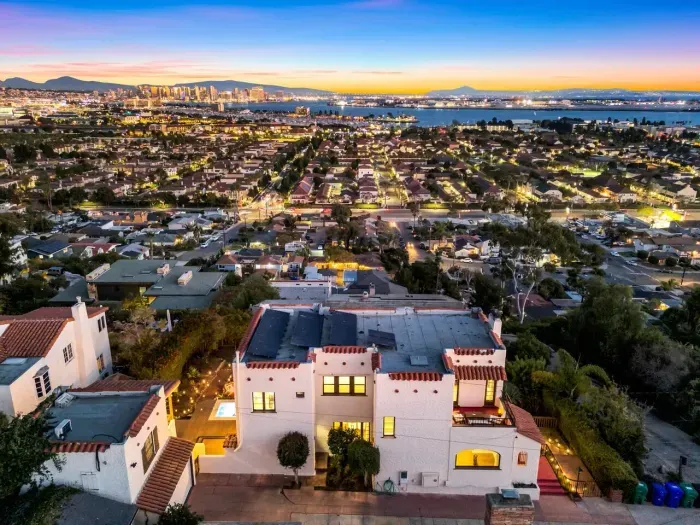 Perched above the streets, the villa’s golden glow mirrors the horizon. Every corner radiates quiet elegance — perfect for a night of calm and candlelight.