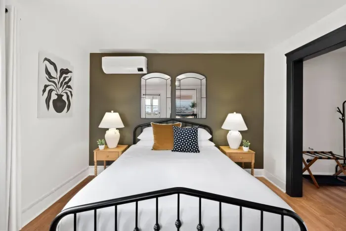 Sweet dreams await in this cozy bedroom with elegant decor and warm lighting — your retreat after a day of adventure.