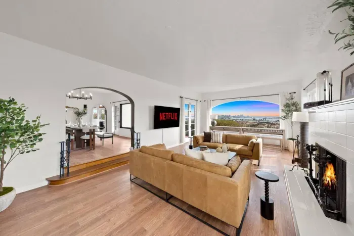 Stream your favorite shows in a bright, open living room filled with natural light.