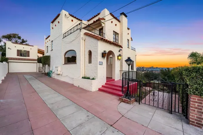This Spanish-style entryway sets the tone: elegant, timeless, and filled with coastal character.
