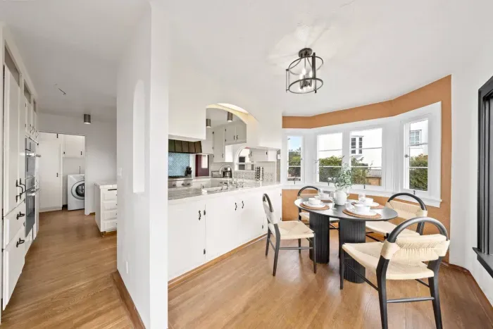 The kitchen flows into a dining nook made for connection and conversation.