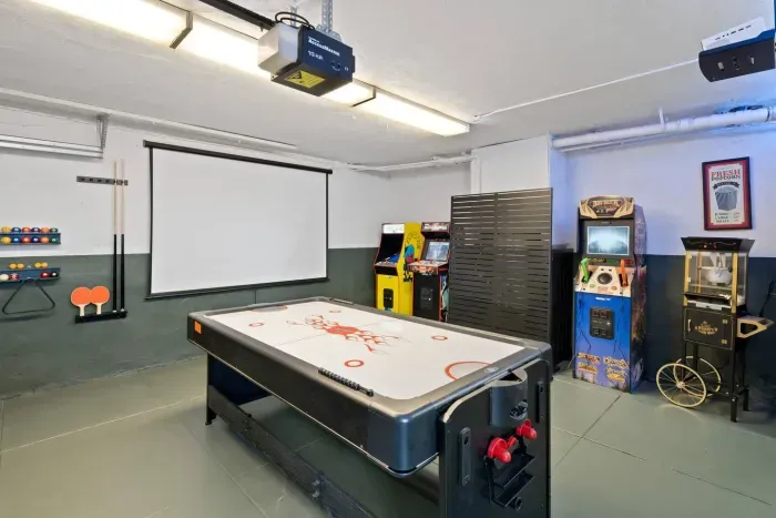 Game on! Enjoy air hockey and retro arcade fun in your private game room — perfect for friendly competition and family laughter.