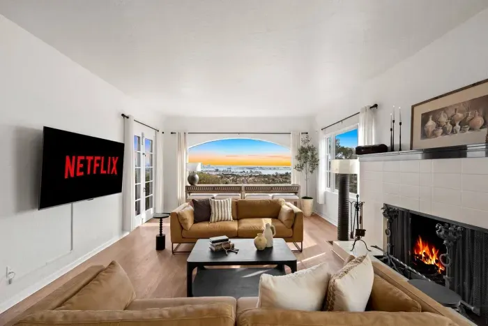 Relax and recharge in this stylish living room — complete with a Netflix-ready TV and comfy seating for the whole crew.