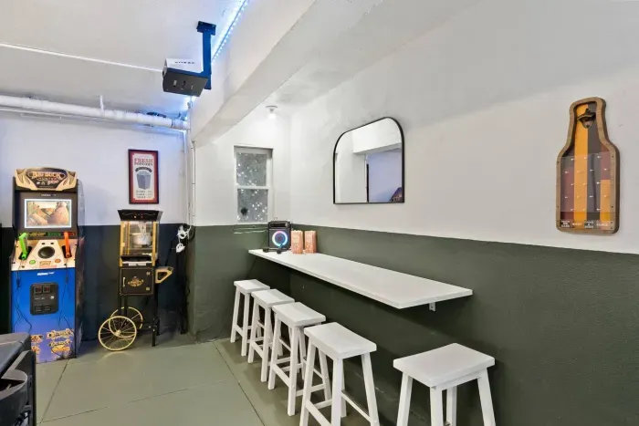 Sleek and inviting, this bar space is ideal for drinks, chats, or friendly games late into the night.
