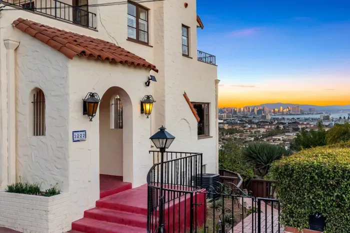 The warm Spanish-style entry welcomes you home — every archway crafted to invite and delight.
