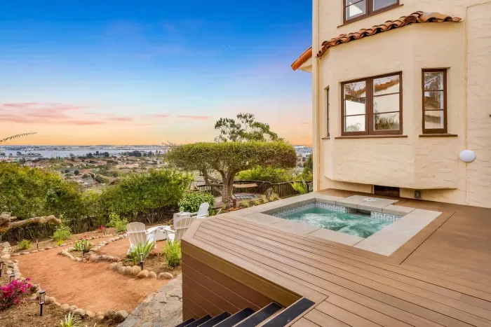 Sink into the spa as the horizon fades into gold and lavender.