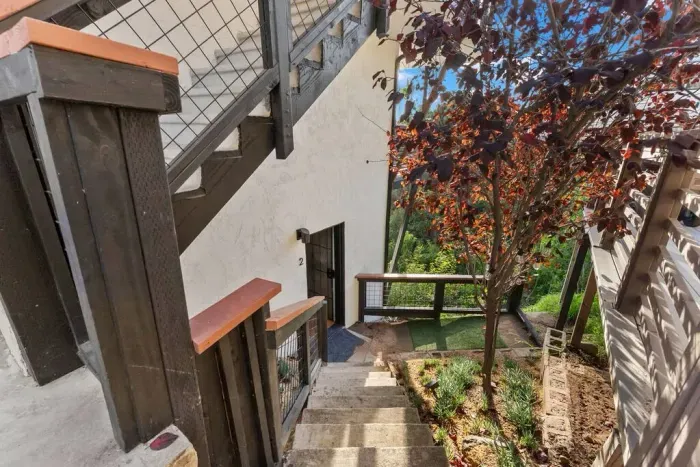 Stairs leading to peaceful outdoor hideaway vibes.