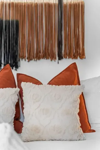 Plush pillows and warm tones for extra-comfy nights.