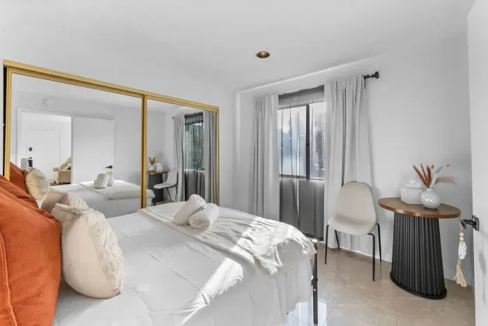 Soft linens and sunshine make this bedroom hard to leave.