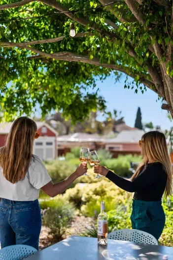 Shaded garden patio with string lights—perfect for sunset sips