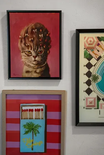 Playful gallery wall with Palm Springs flair and retro art charm.