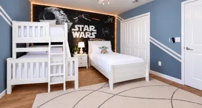 Fun Star Wars-themed bedroom with bunk beds and twin bed