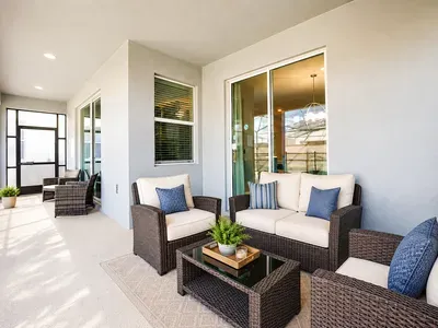 Covered patio with stylish lounge seating for relaxing outdoor gatherings