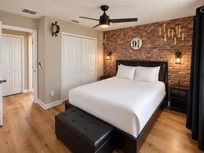 Cozy Harry Potter-themed bedroom with brick wall and warm lighting