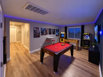 Fun-filled game room with pool, foosball, arcades, and LED mood lighting