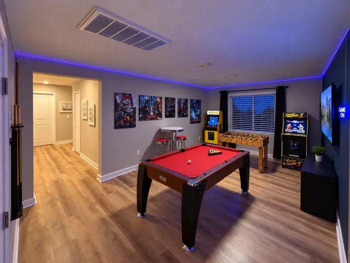Fun-filled game room with pool, foosball, arcades, and LED mood lighting